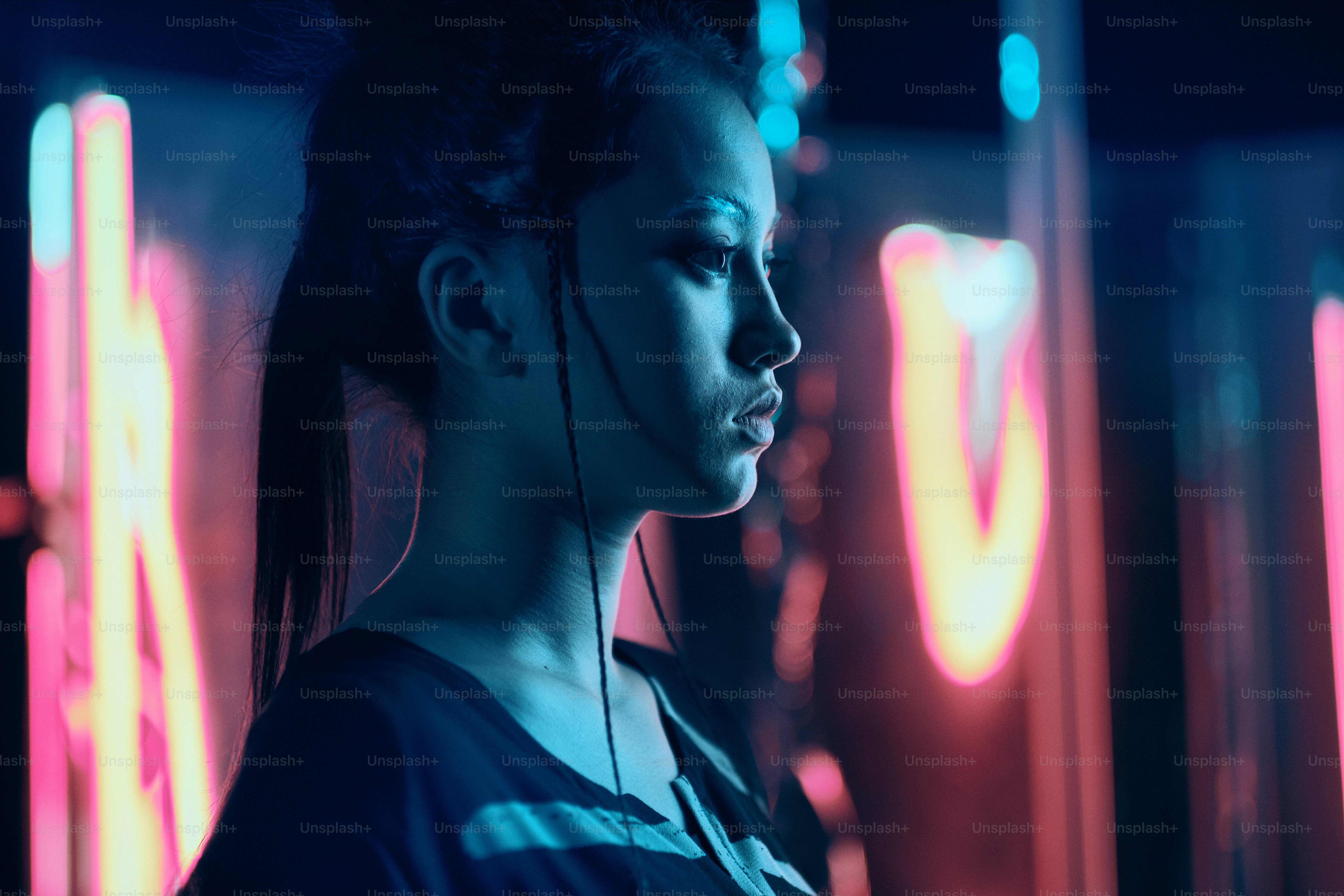 Futuristic portrait of asian teenager in neon light with sword like lamps. She is seriour, daring, cyberpunk fashionable girl with white eyebrows