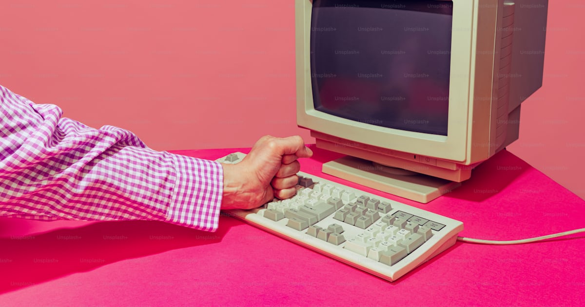 Colorful image of vintage computer monitor and keyboard isolated over ...