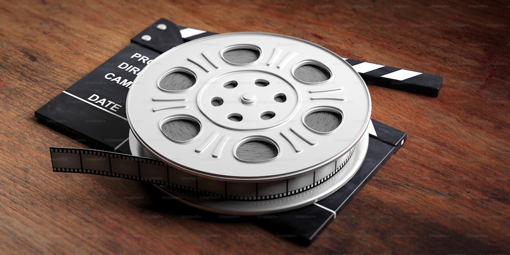 Free: An elevated view of clapperboard; film reels; film strips on wooden  backdrop Free Photo 