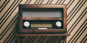 Vintage, retro radio. Radio old fashioned on wooden table, old fashioned wall background, 3d illustration