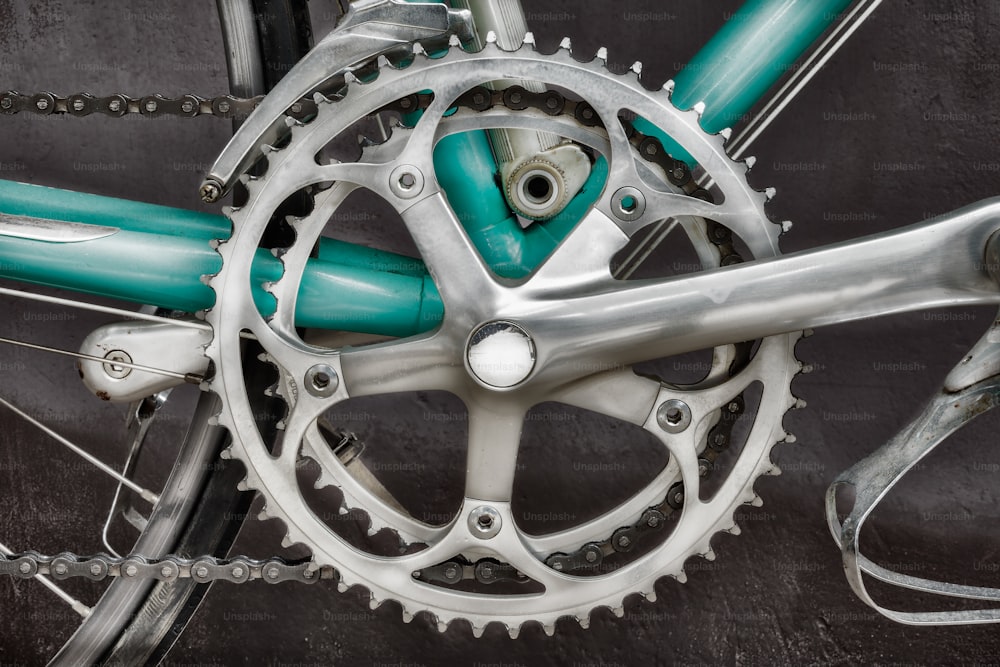 Close up of the derailleur of a vintage seventies light blue racing bicycle