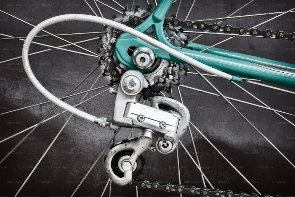 Close up of the derailleur of a vintage seventies light blue racing bicycle
