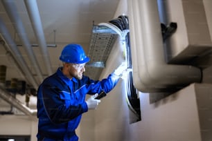 PVC Water Pipe Inspection By Construction Worker