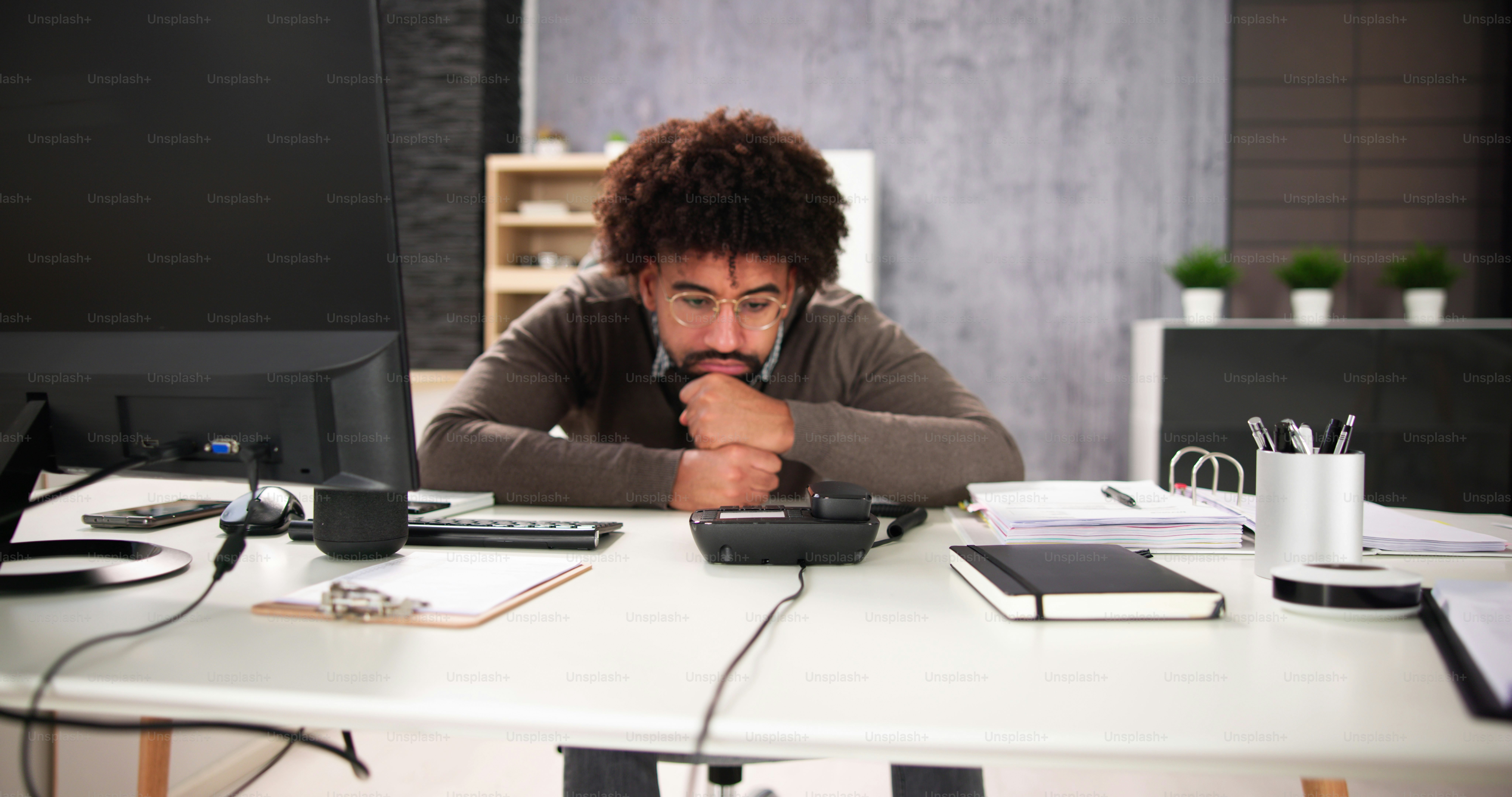 Waiting For Phone Call On Office Landline At Desk