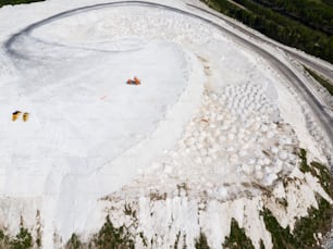 Aerial view of large White Mountain of industrial phosphogypsum wastes - unusual tourist attraction near Voskresensk in Moscow oblast, Russia