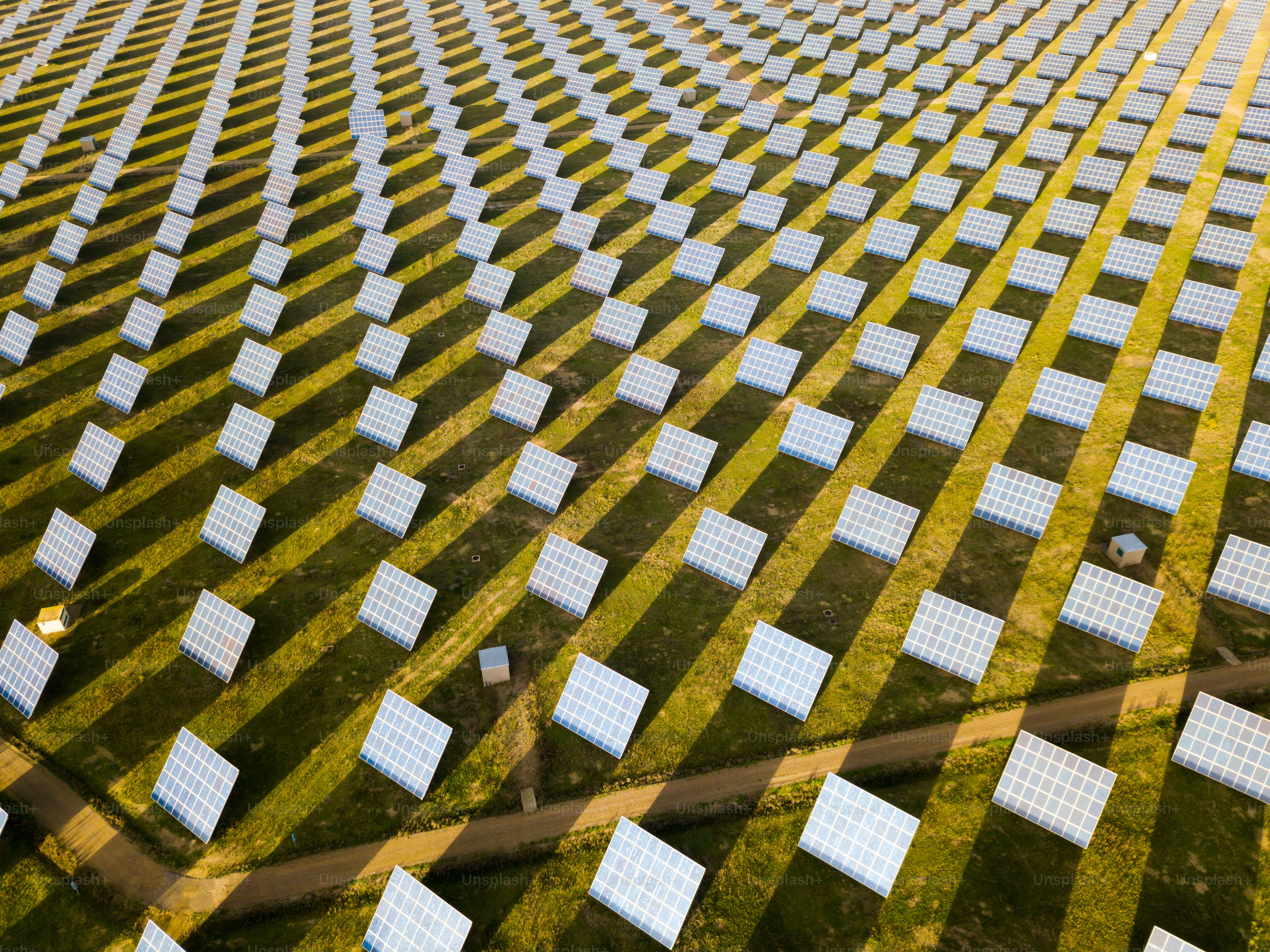 Aerial view of solar power station installed in green field