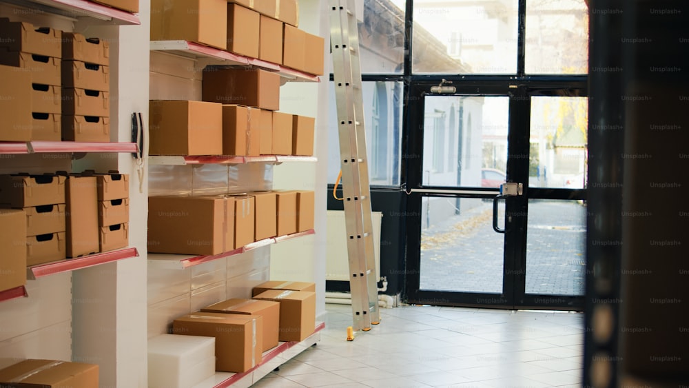 Storage room filled with boxes on racks and shelves, merchandise stock and cargo packages in warehouse. Manufacturing supplies packed in big containers, pallets in storehouse space. Handheld shot.