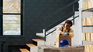 Group of workers preparing packages with goods in warehouse, packing merchandise in cardboard boxes. Employees checking packs with products and cargo, shipment stock distribution.