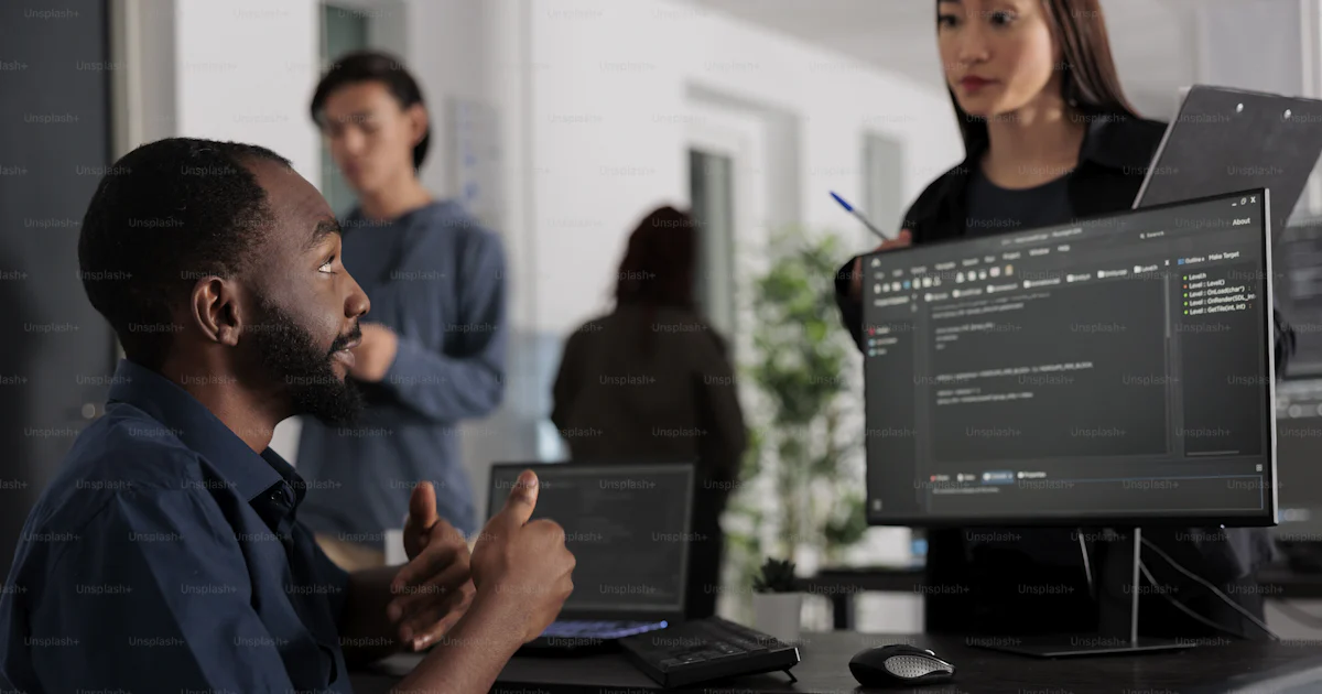diverse tech enginners developing software algorithm... Diverse group of web developers analyzing html code and comparing data ...