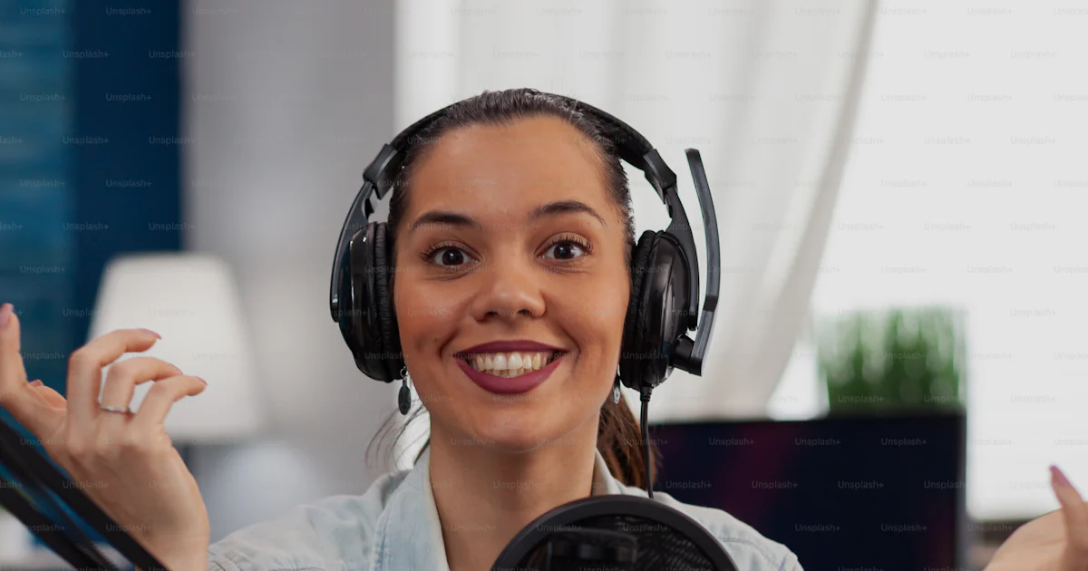 Broadcasting Portrait Portrait of smiling presenter streaming podcast using microphone ...