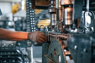 Man in uniform is in workstation developing details of agriculture technique.