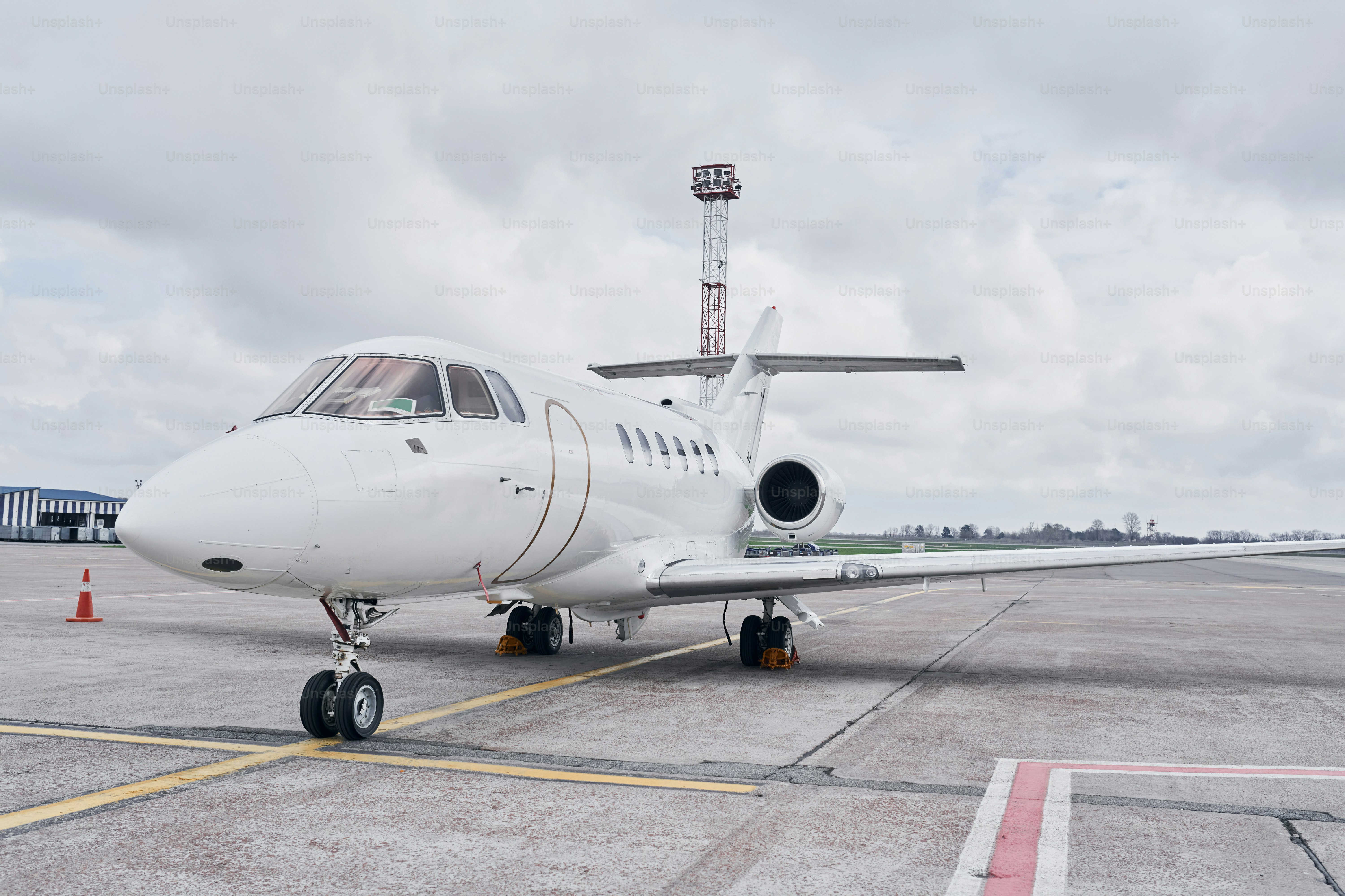 Front view. Turboprop aircraft parked on the runway at daytime