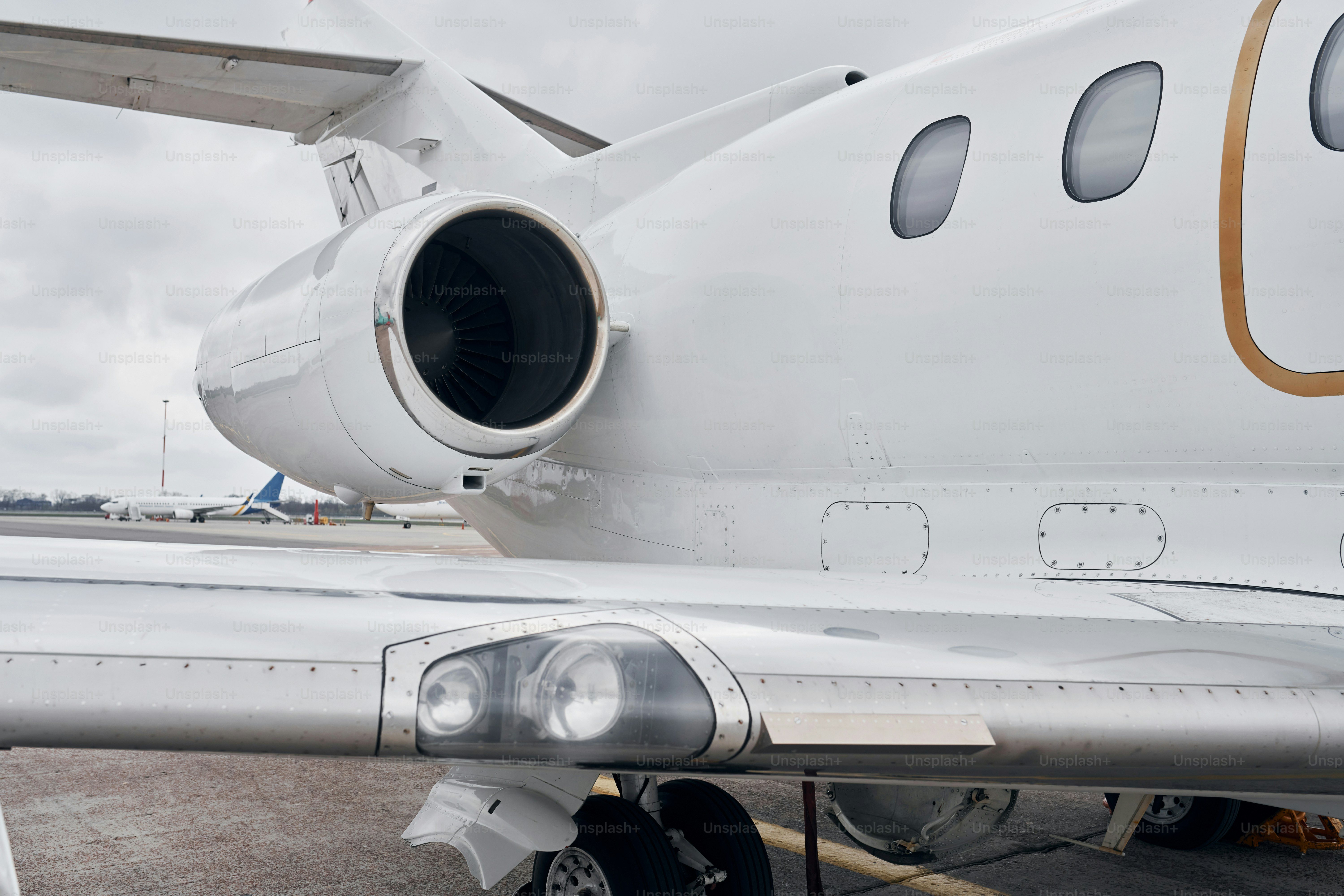 Close up view. Turboprop aircraft parked on the runway at daytime.