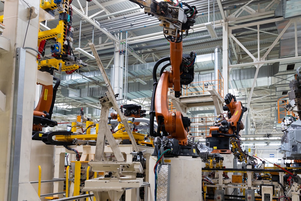 Photo of automobile production line. Modern car assembly plant. Auto industry. Interior of a high-tech factory, modern production.