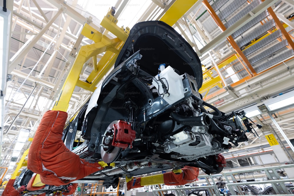 Automobile production line. Welding car body. Modern car assembly plant. Auto industry. Interior of a high-tech factory, modern production.