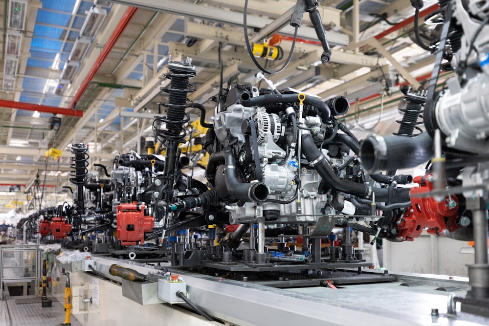 Photo of automobile production line. Welding car body. Modern car assembly plant. Auto industry. Interior of a high-tech factory, modern production.