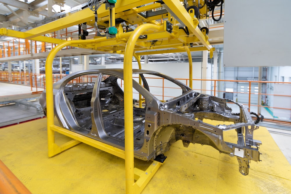 One is body of car close up. Modern technology of Assembly of cars. plant of automotive industry. Shop for the production and Assembly of machines. process of welding parts of the car
