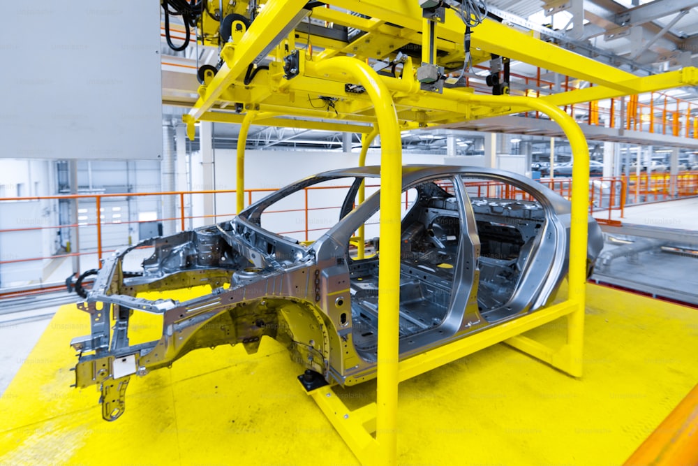 Assembly line production of new car. modern automated assembly line for cars. latest technological neutral technologies of production of cars at plant. Assembly of cars on conveyor.