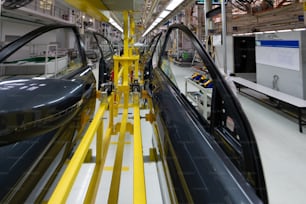 Automated car Assembly line. Assembly of car door. plant of automotive industry. Line of car body