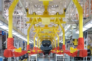 Automated car Assembly line. plant of automotive industry. Shop for production and Assembly of machines. New car warehouse