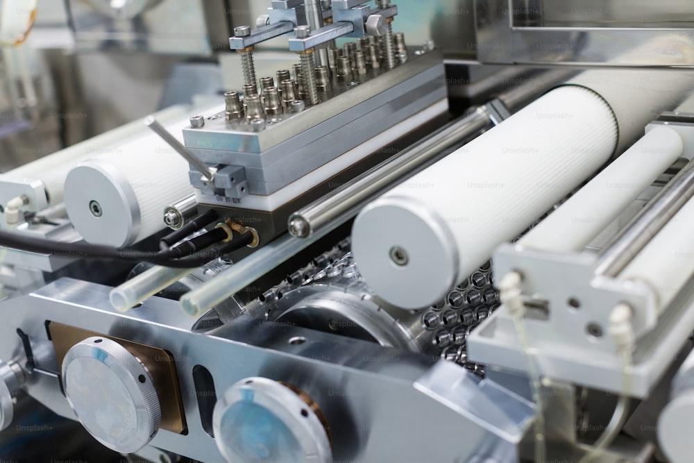 close look of part with shafts in manufacture machine