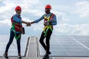 Engineer working setup Solar panel at the roof top. Engineer or worker work on solar panels or solar cells on the roof of business building