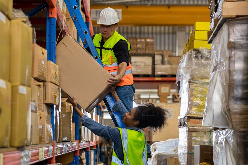 African American worker working in warehouse. Industrial and industrial workers concept. worker woman order details and checking goods and Supplies.