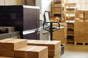 Background image of printing factory workshop with focus on boxes in warehouse, copy space