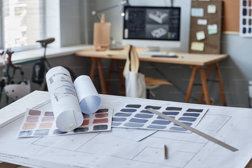 Background image of floor plans and color swatches in designers office, copy space