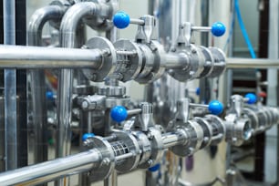 Steel pipeline system at brewery, beer production concept
