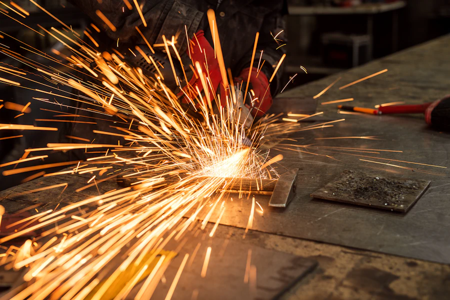 Sparks flying as steel plate is cut and ground