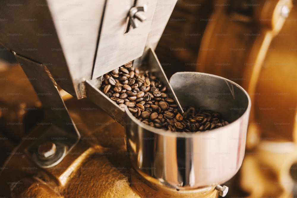 Close up of coffee beans in grinding coffee machine.