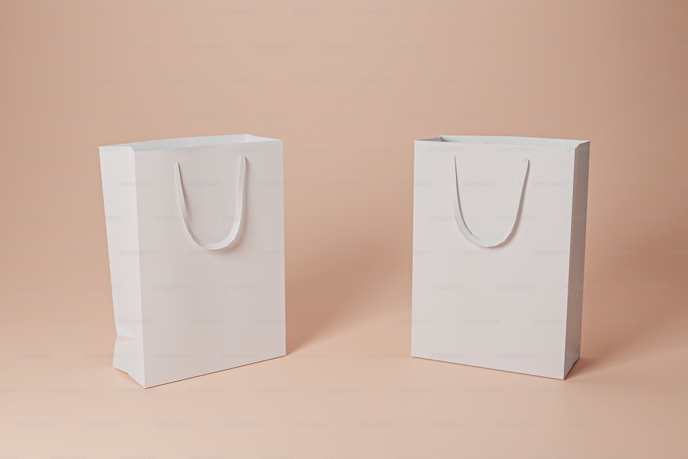 a pair of white bags sitting on top of a table
