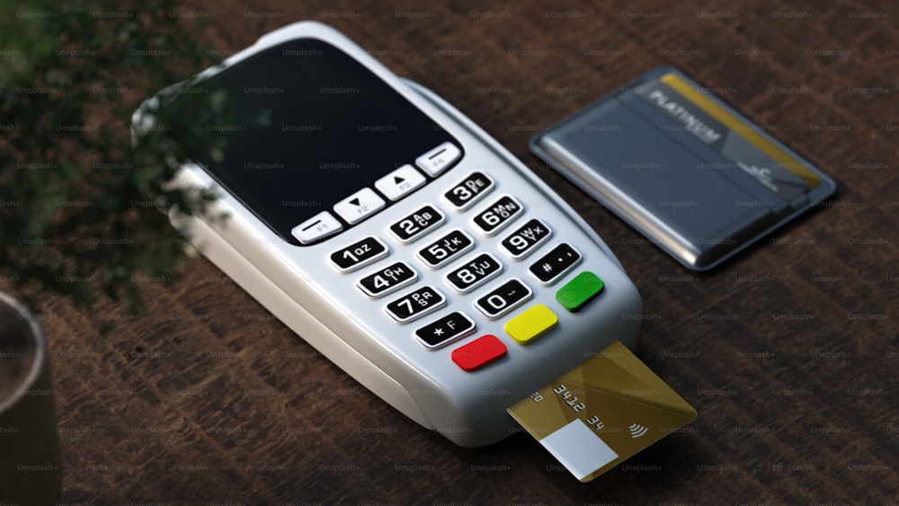 a cell phone and a credit card on a table