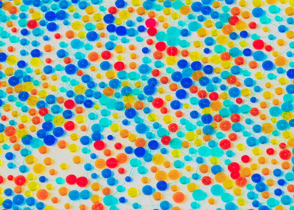 a multicolored polka dot pattern on a white background