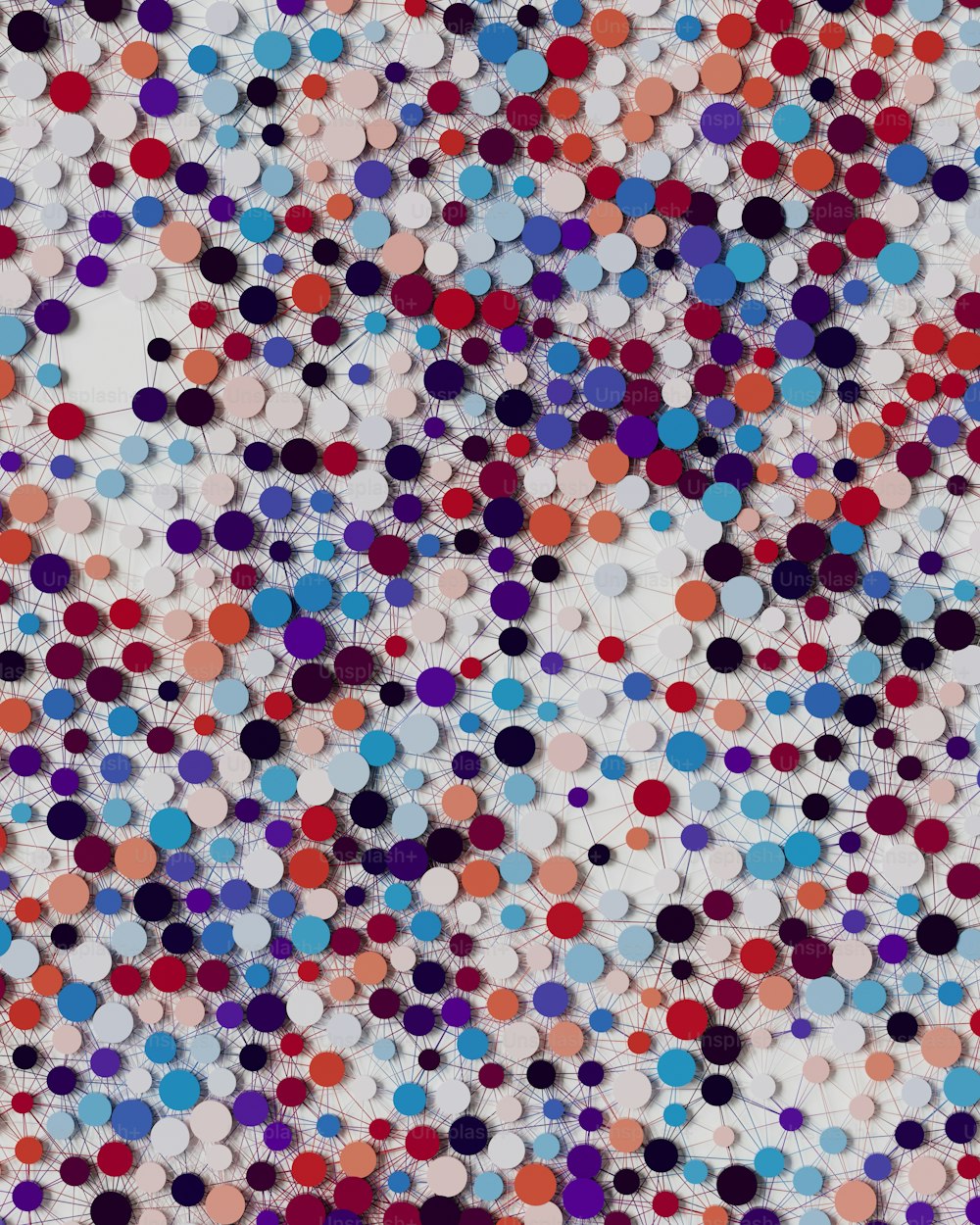a multicolored pattern of circles on a white background