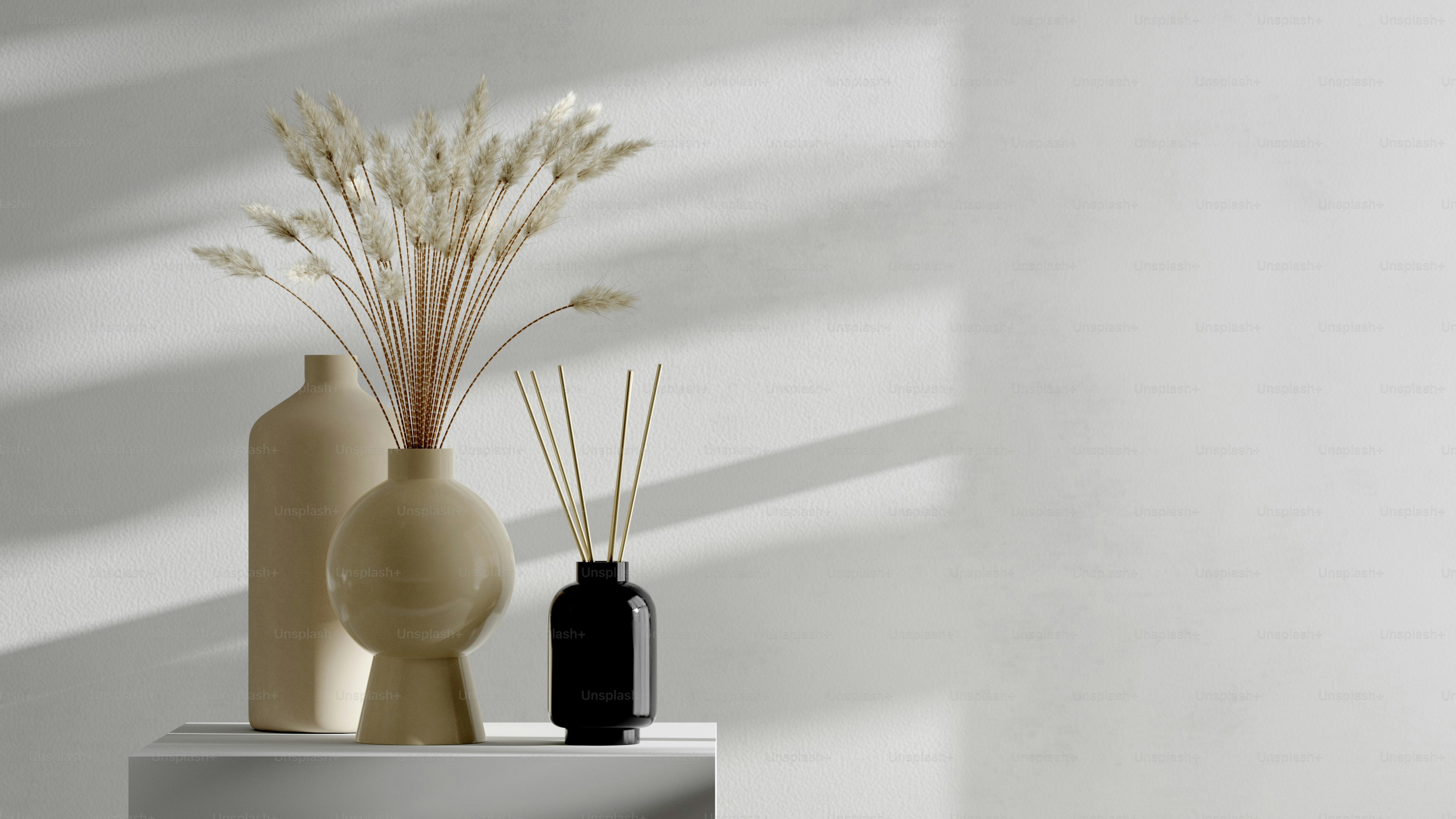 a couple of vases sitting on top of a table