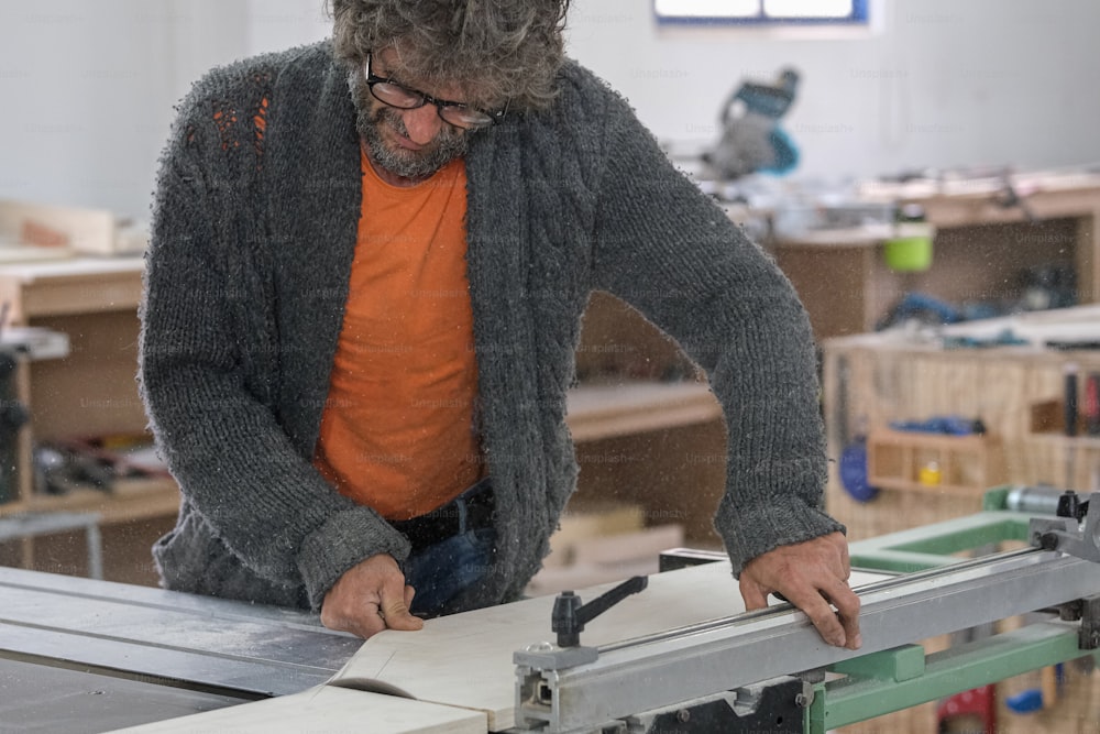 a man working on a piece of wood