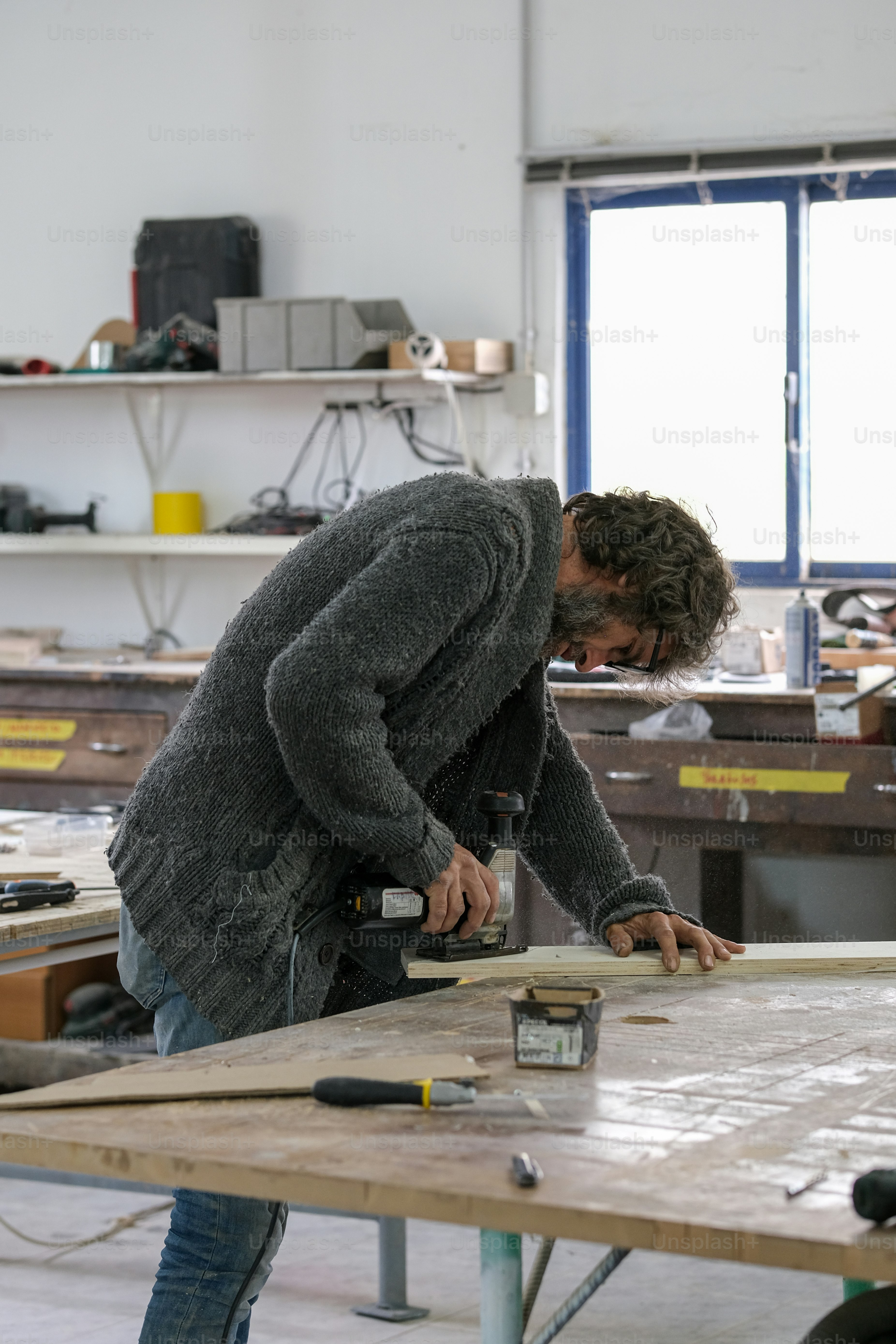 a man working on a piece of wood