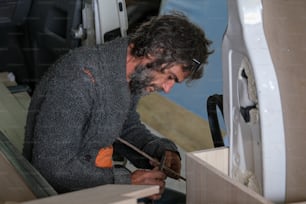 a man working on a piece of wood