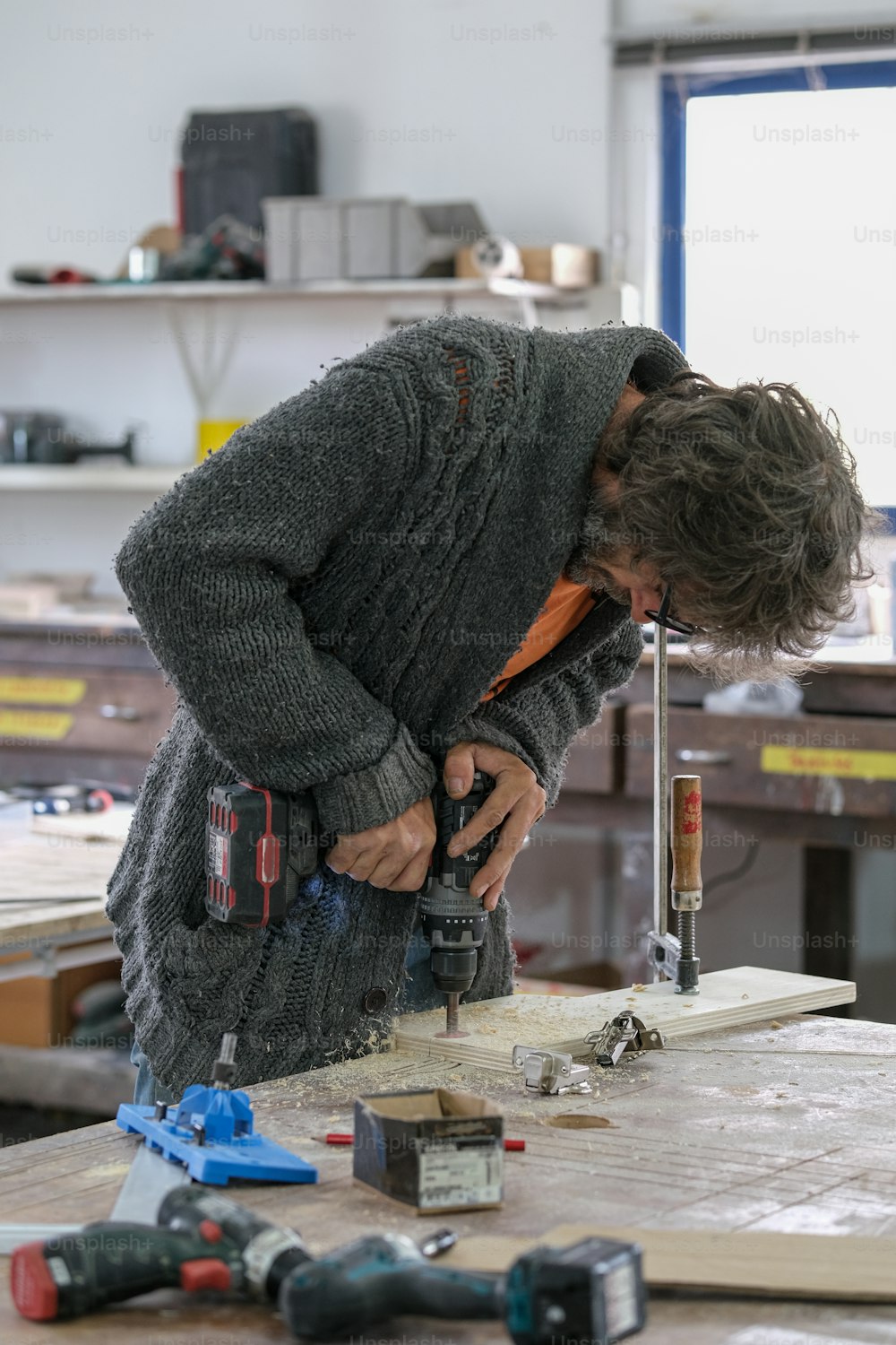 a man working on a piece of wood