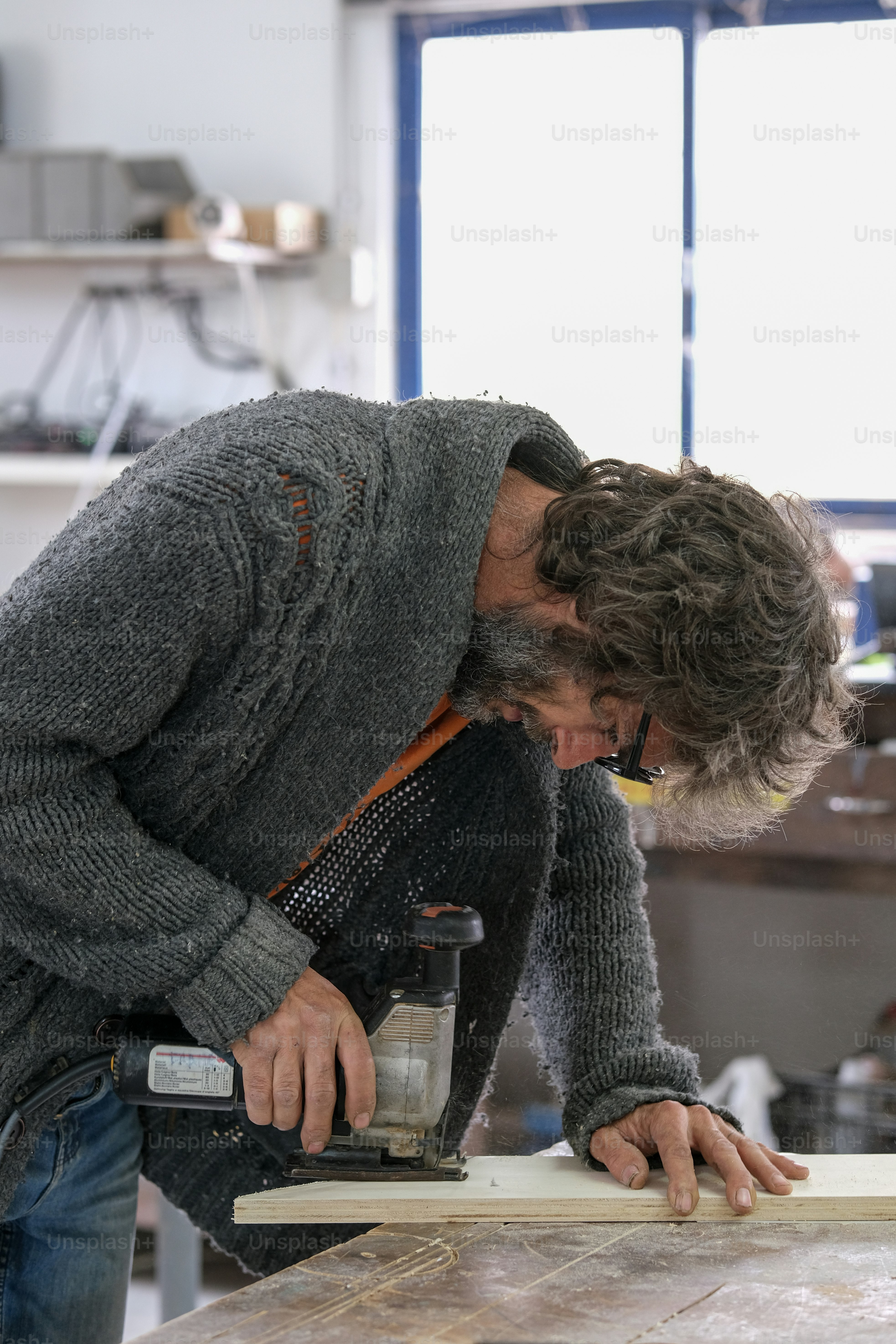 a man working on a piece of wood
