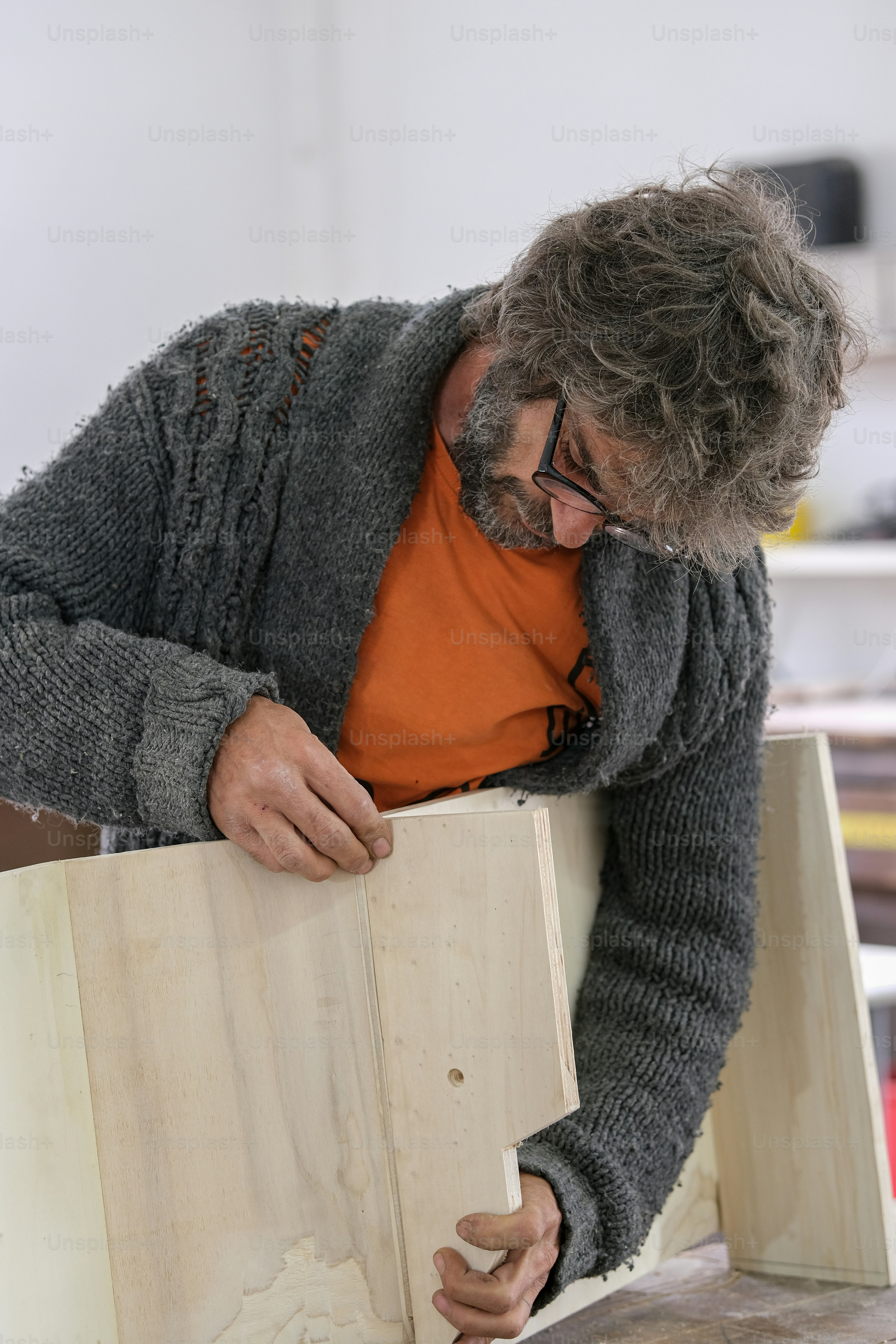 a man working on a piece of wood