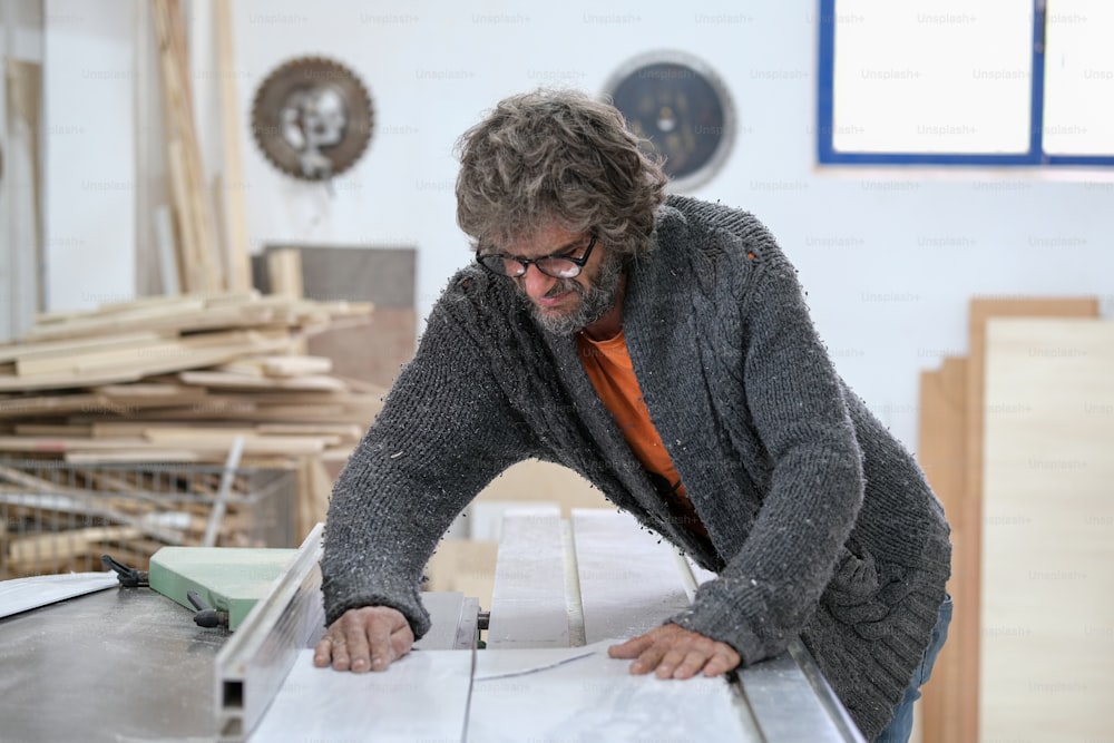 a man working on a piece of wood