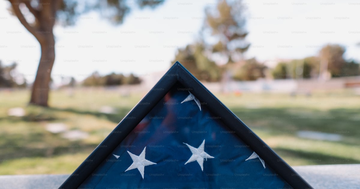 A triangle shaped flag on top of a table photo – Patriotism Image on ...