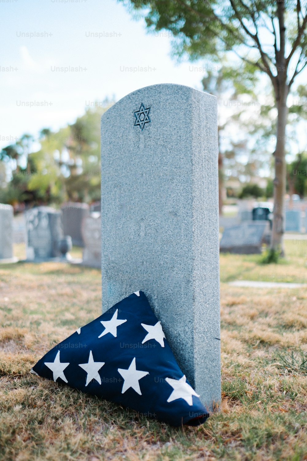 a flag laying on top of a grave