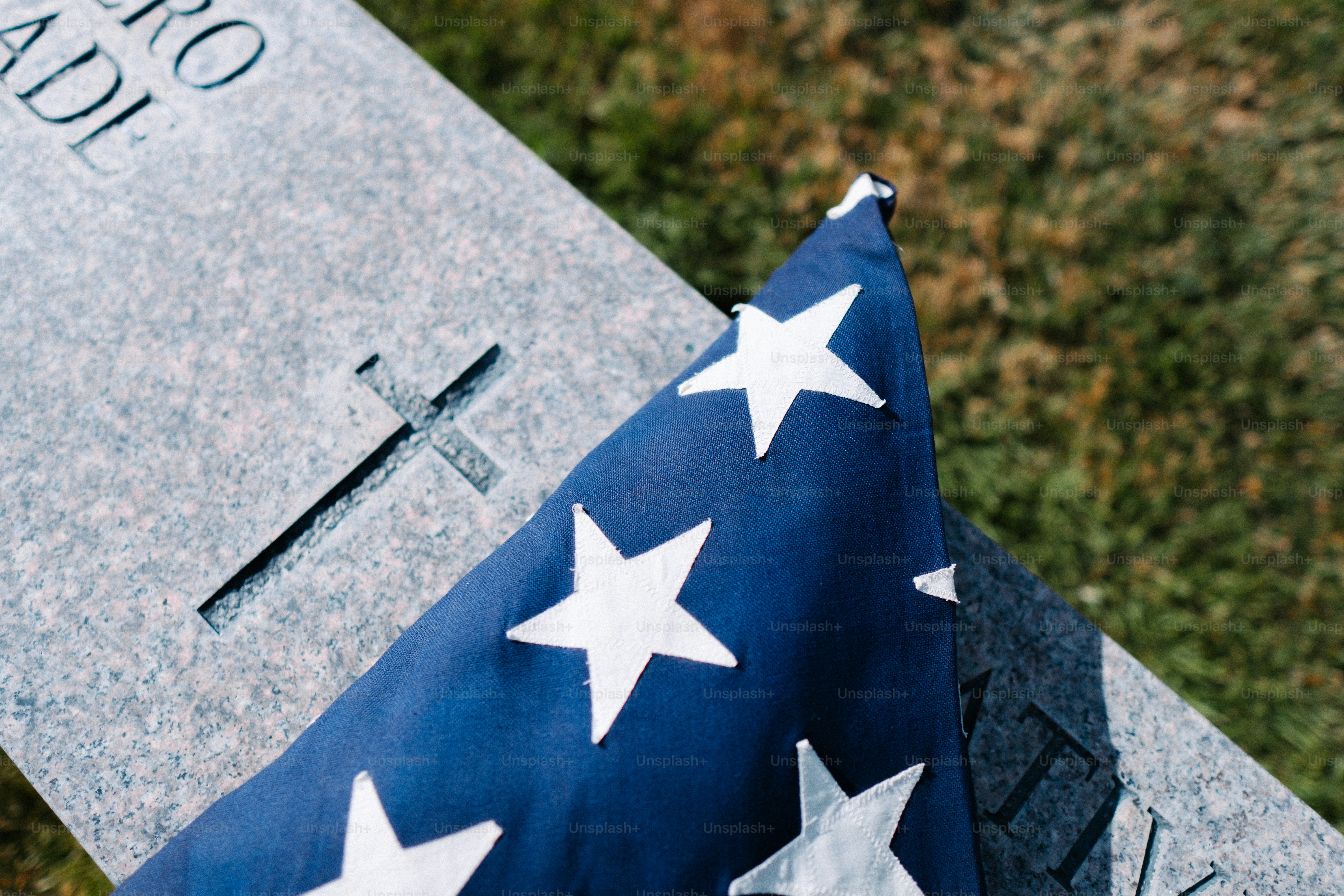 a flag laying on top of a grave