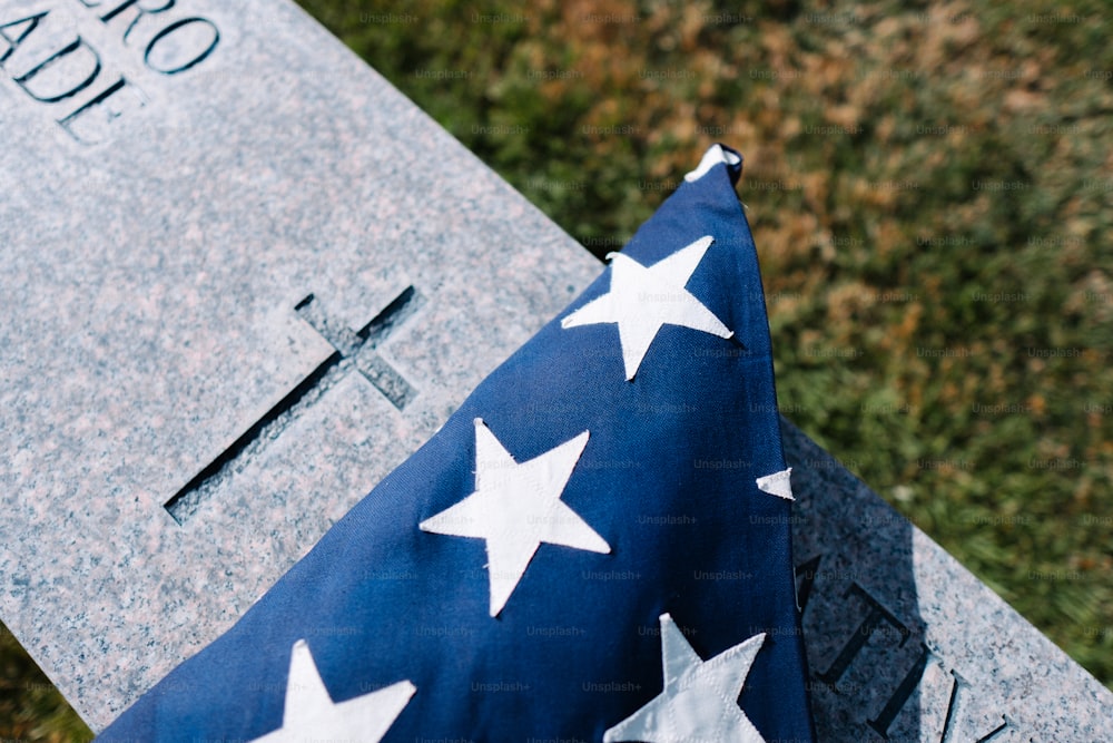a flag laying on top of a grave
