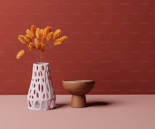 un vaso con alcuni fiori accanto a una ciotola