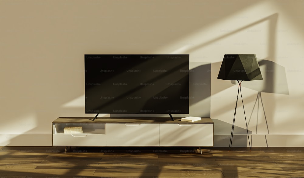 a flat screen tv sitting on top of a tv stand